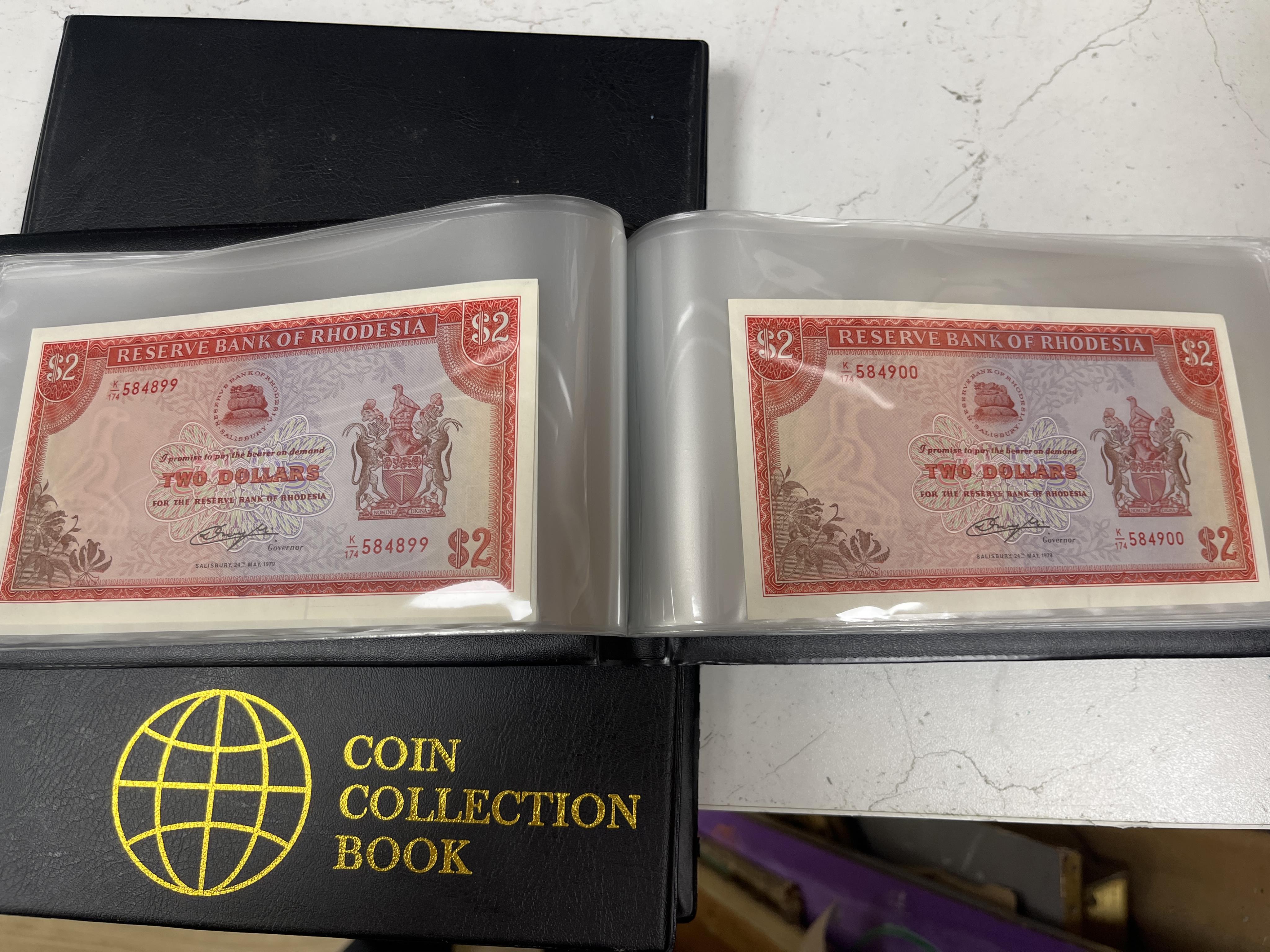 Southern Rhodesia, South Africa and Europe coins, early to late 20th century, and Victoria, and later pennies, Rhodesia, Japan, Zimbabwea banknotes, in two albums